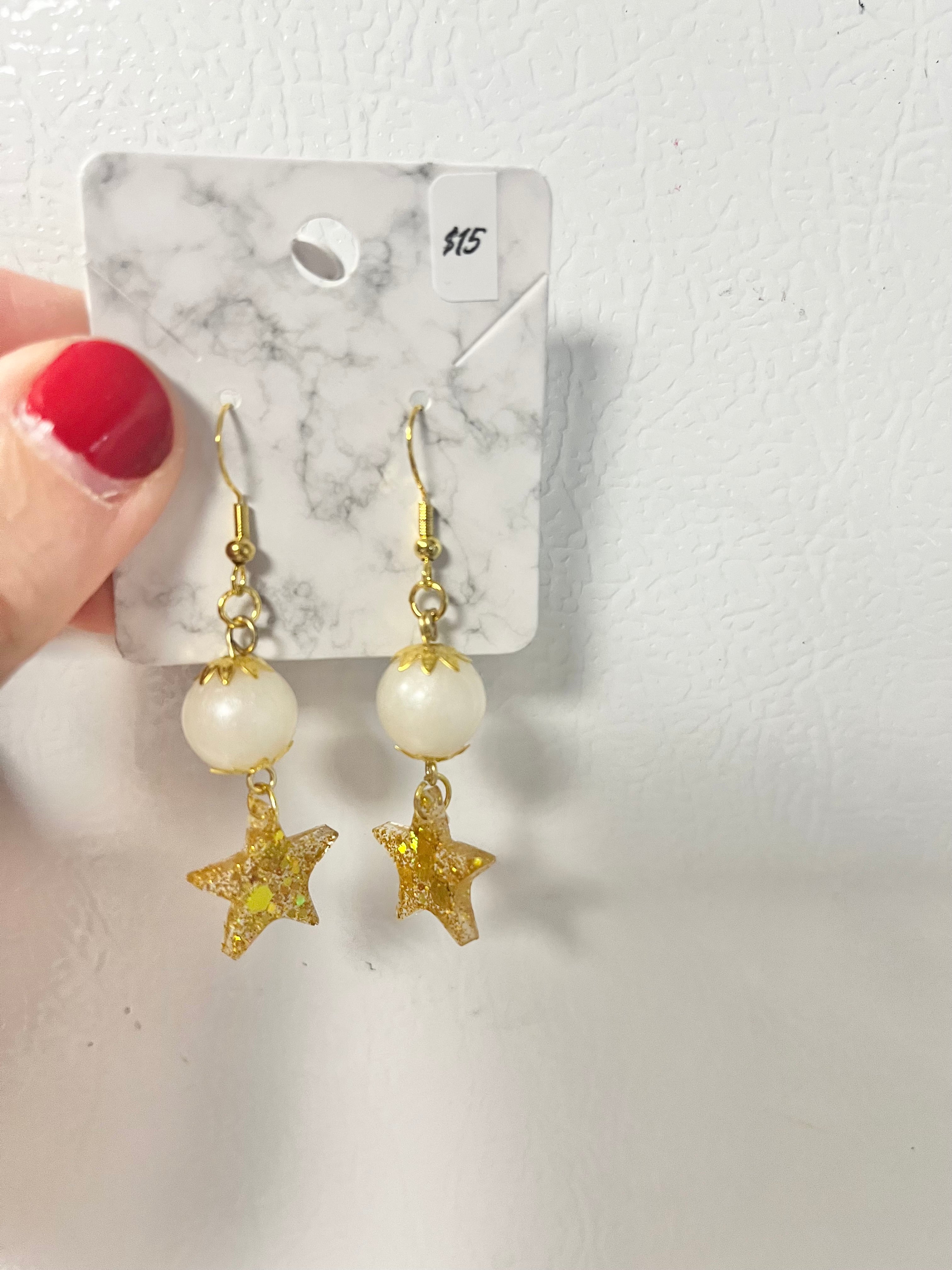 Gold star and bead earrings