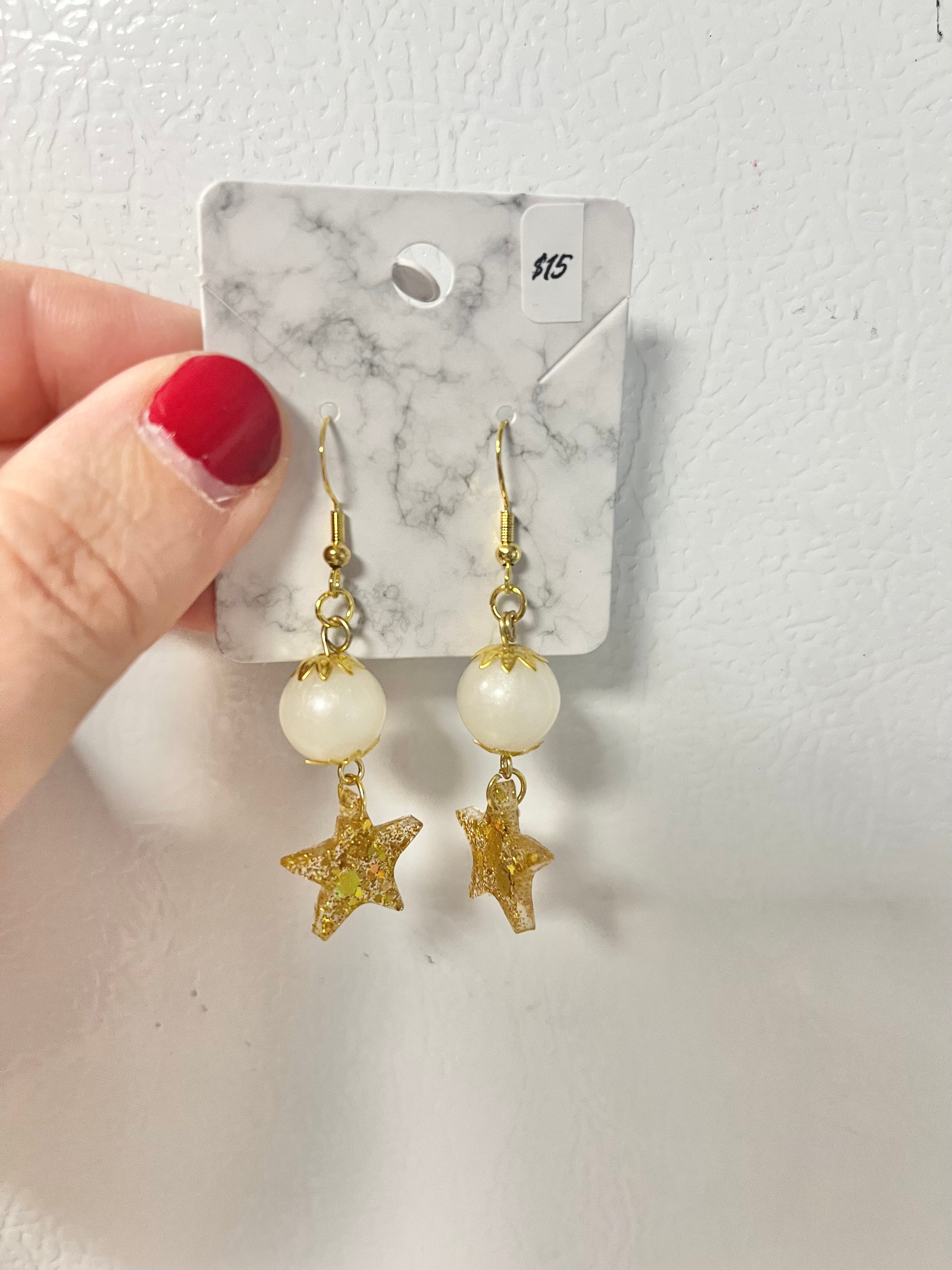 Gold star and bead earrings