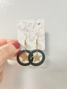 Black and gold star earrings