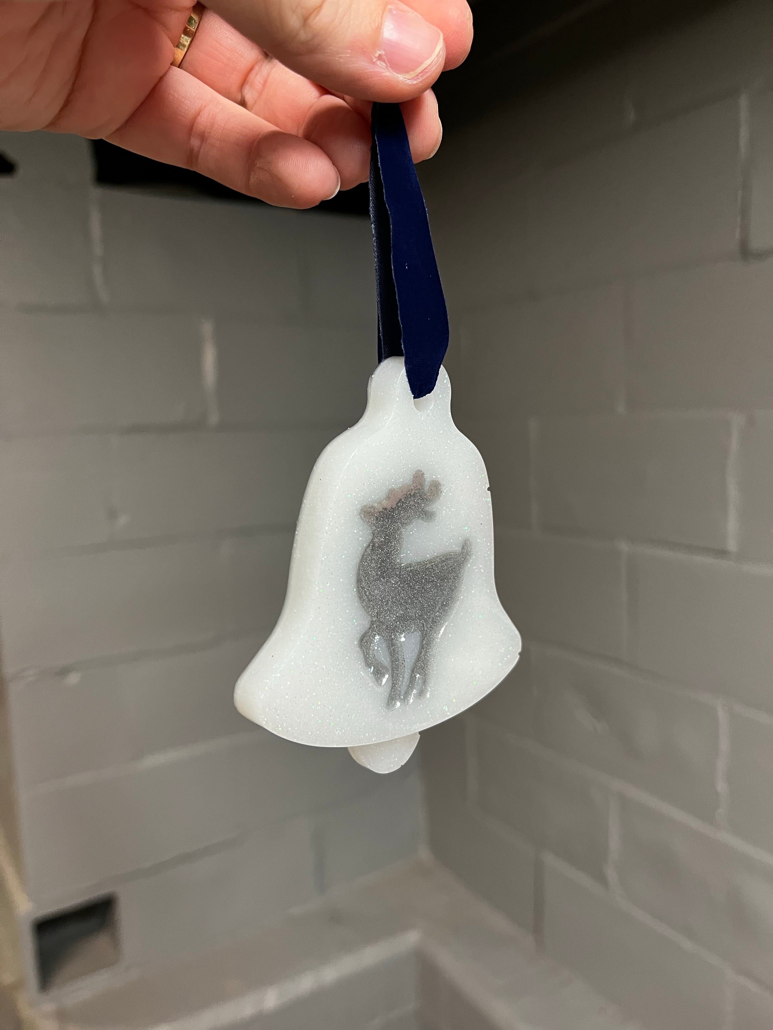 White and silver reindeer bell ornament