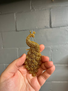 Gold peacock Christmas ornament