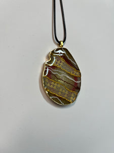 Pink and gold geode pendant necklace