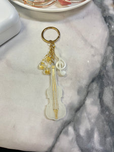 White and gold violin keychain