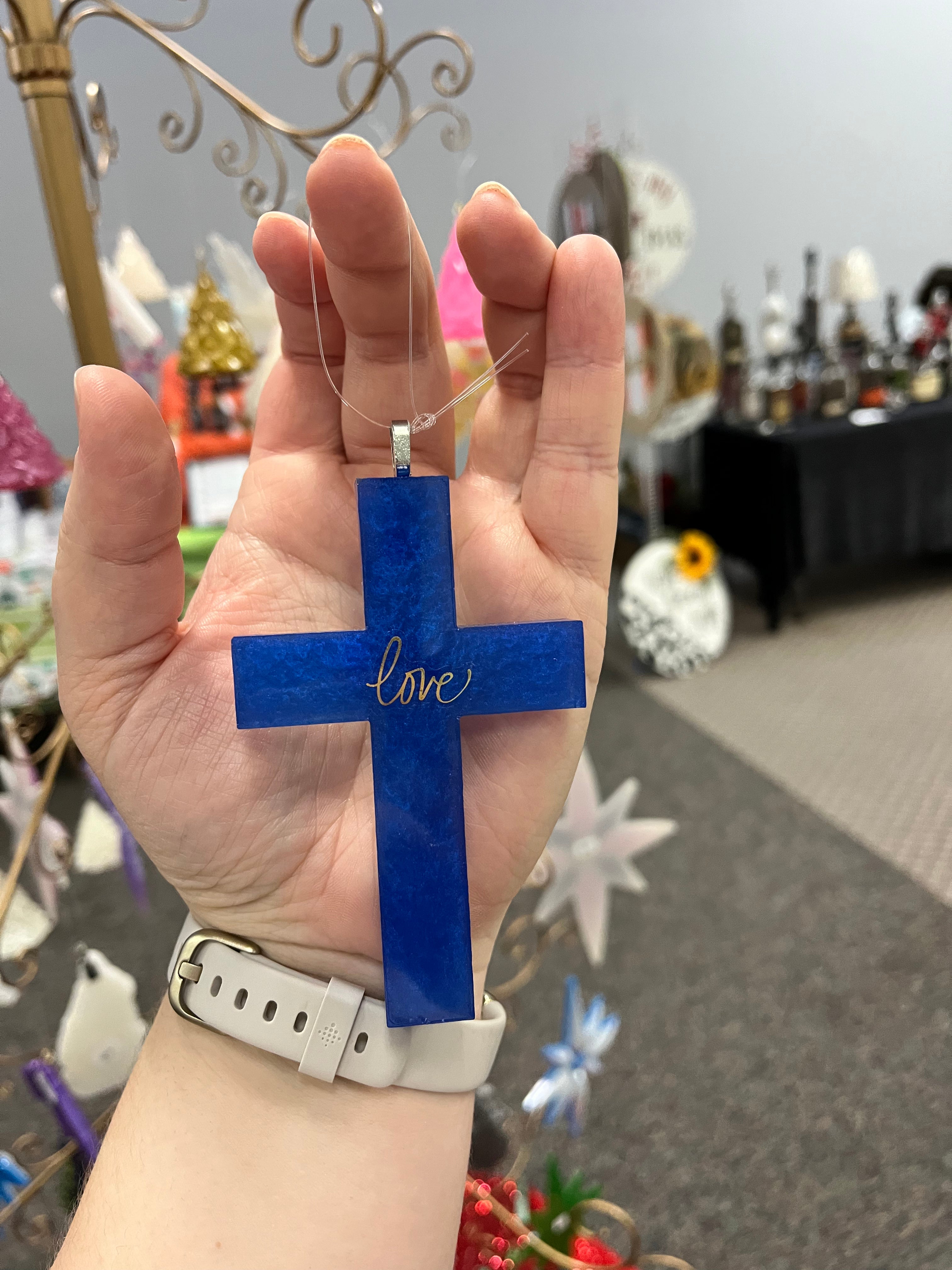 Blue “love” cross