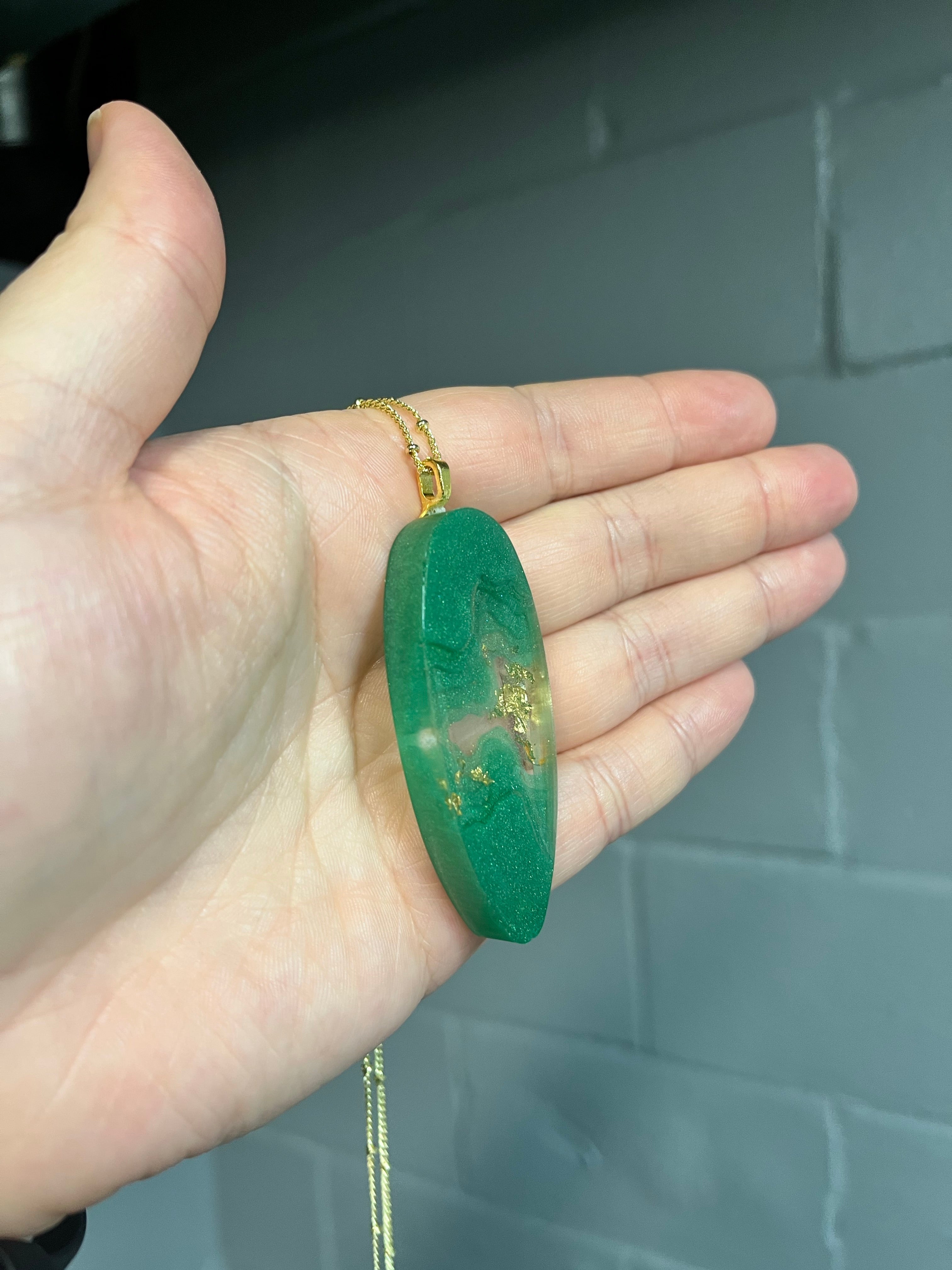 Green and gold oblong landscape pendant necklace