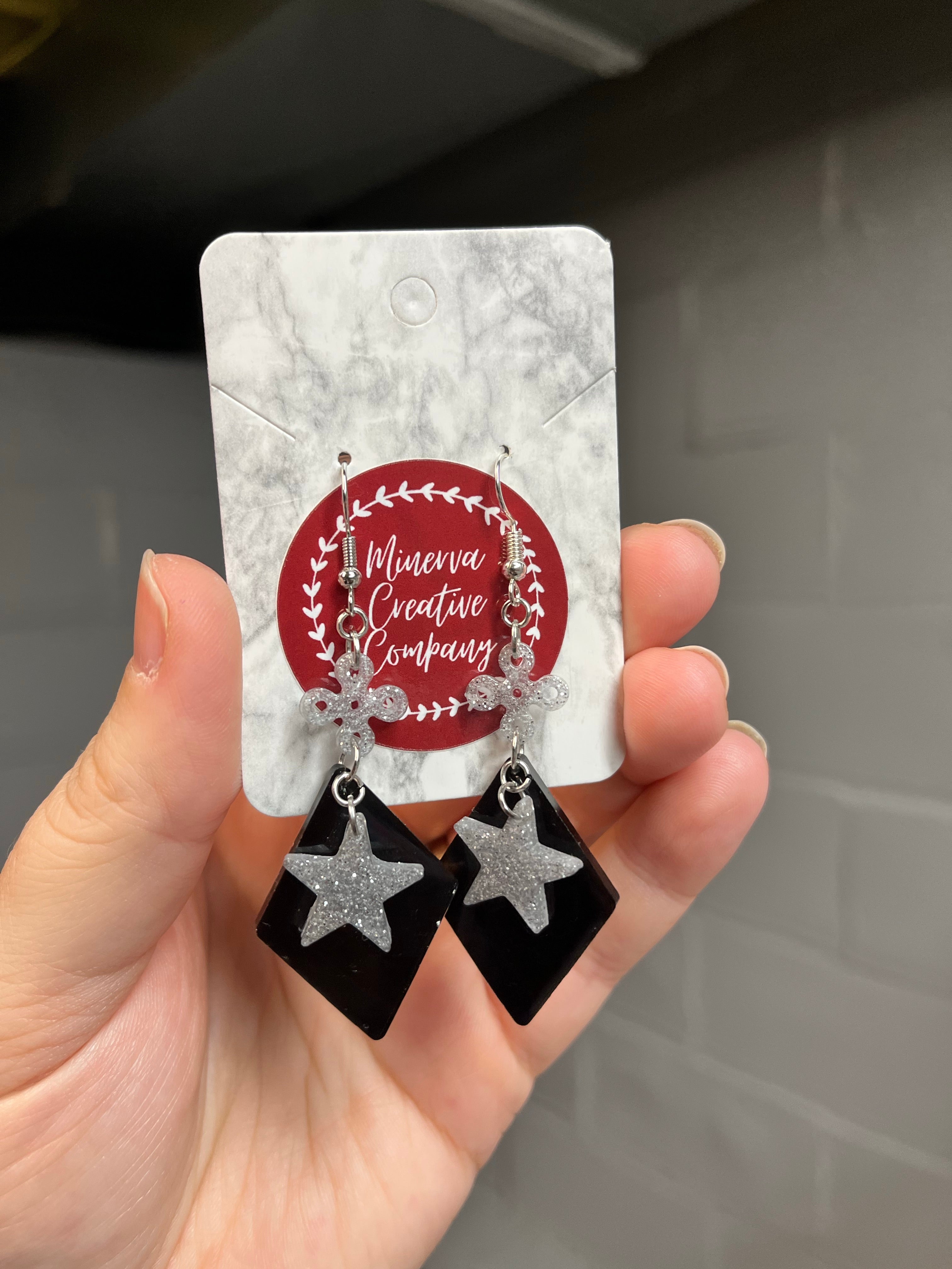 Silver and black star earrings